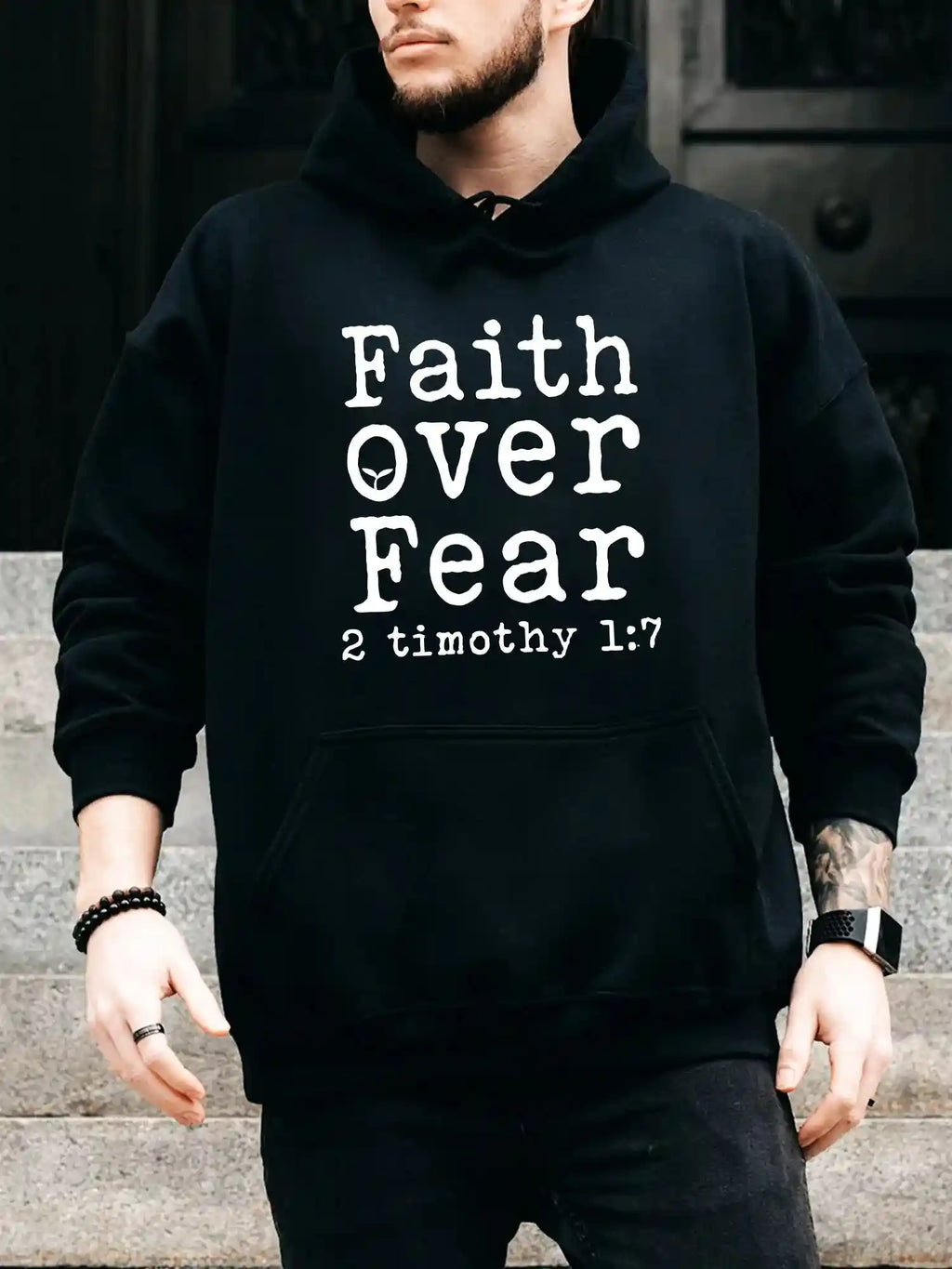 BC Men's Hoodie - Faith Over Fear in bold white text on black fabric, perfect for fall layering with comfort and inspirational style.