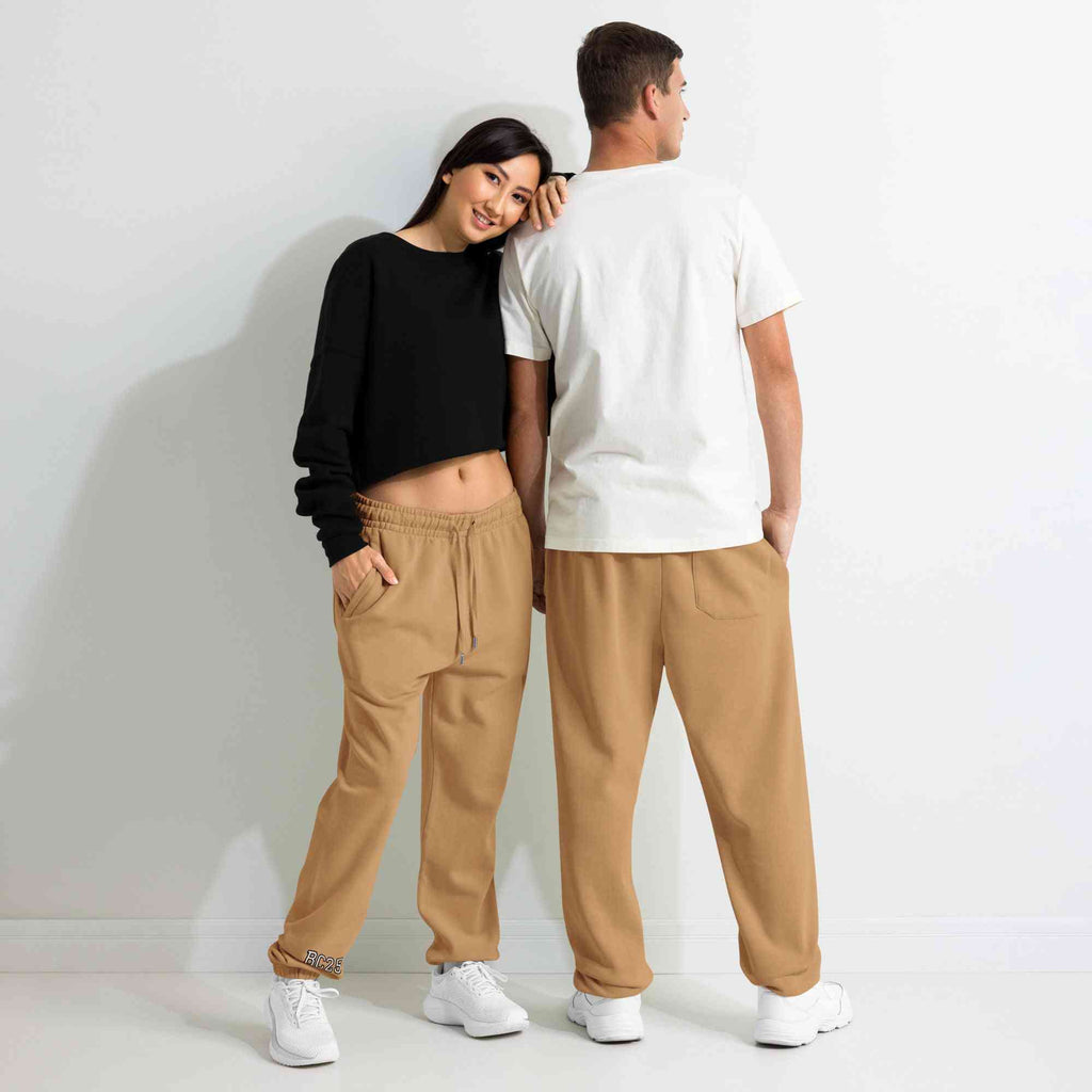 BC Sweatpants -Heavyweight Fleece in camel brown worn by male and female models. Relaxed fit loungewear made with 80% cotton and recycled materials.