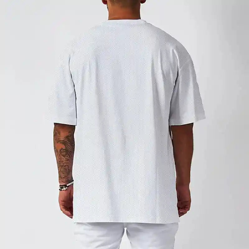 Back view of BC Oversized Quick Dry Running T-shirt - Faith Over Fear. Loose fit design ensures unrestricted movement.